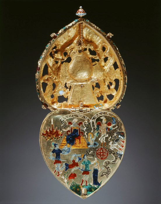 Golden heart-shaped jewel opened up vertically. Busy, colourful scene of multiple figures and Classical symbols.