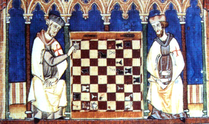 Knights Templar playing chess, from the Libro de los juegos (Book of games), or Libro de axedrez, dados e tablas, (Book of chess, dice and tables) commissioned by Alfonso X of Castile, Galicia and León, 1283. Photo from Wikimedia Commons.
