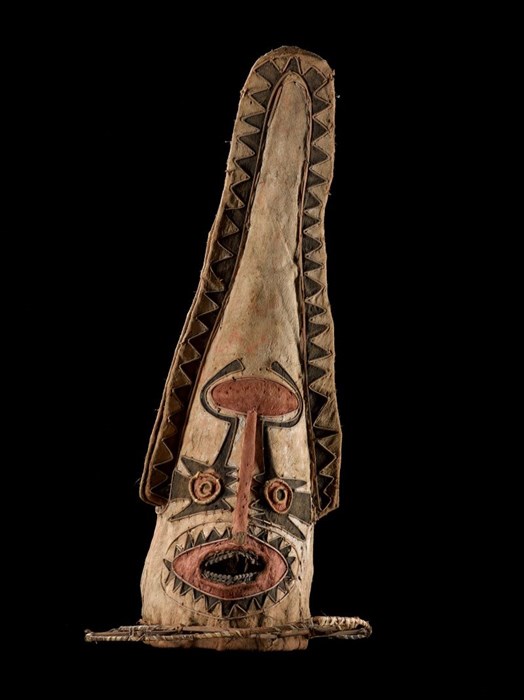 Very tall beige, black and red mask with a mouth that includes teeth and spiral eyes towards the bottom. A small fin with a zigzag pattern runs almost the entire length of the edge of the mask on each side.
