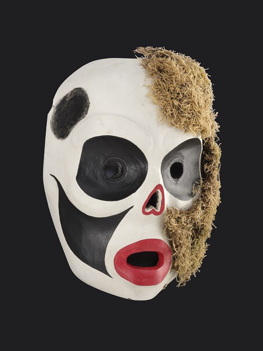 red white and black mask with moss down one side.