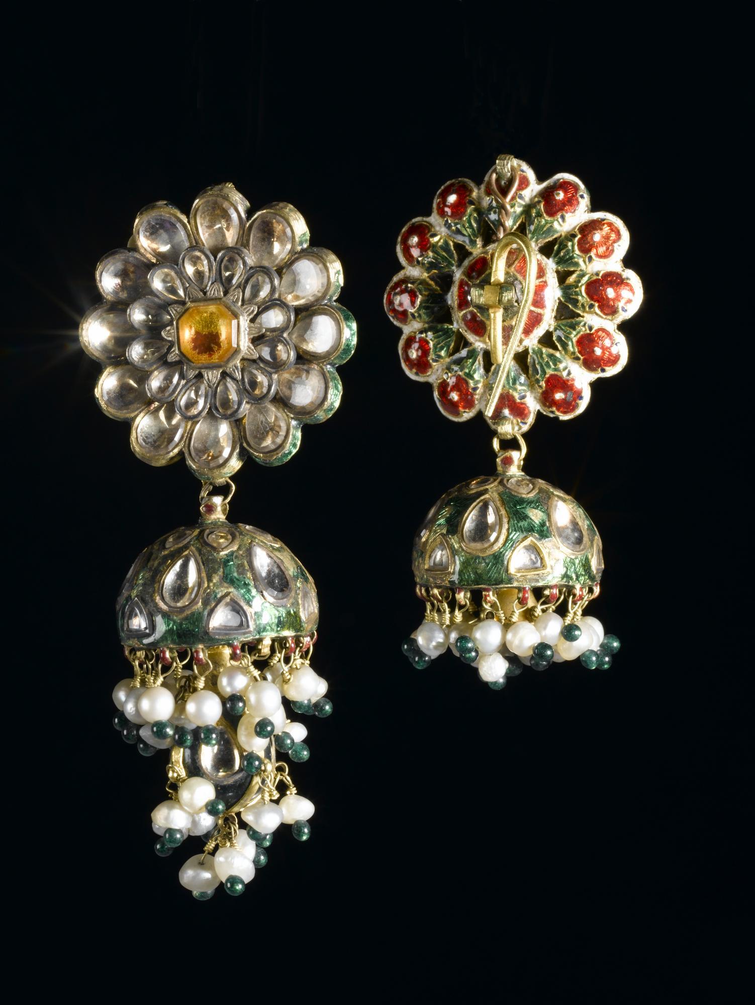 Earrings in the shape of a flower head with inticate detail and beading in drop pendant.