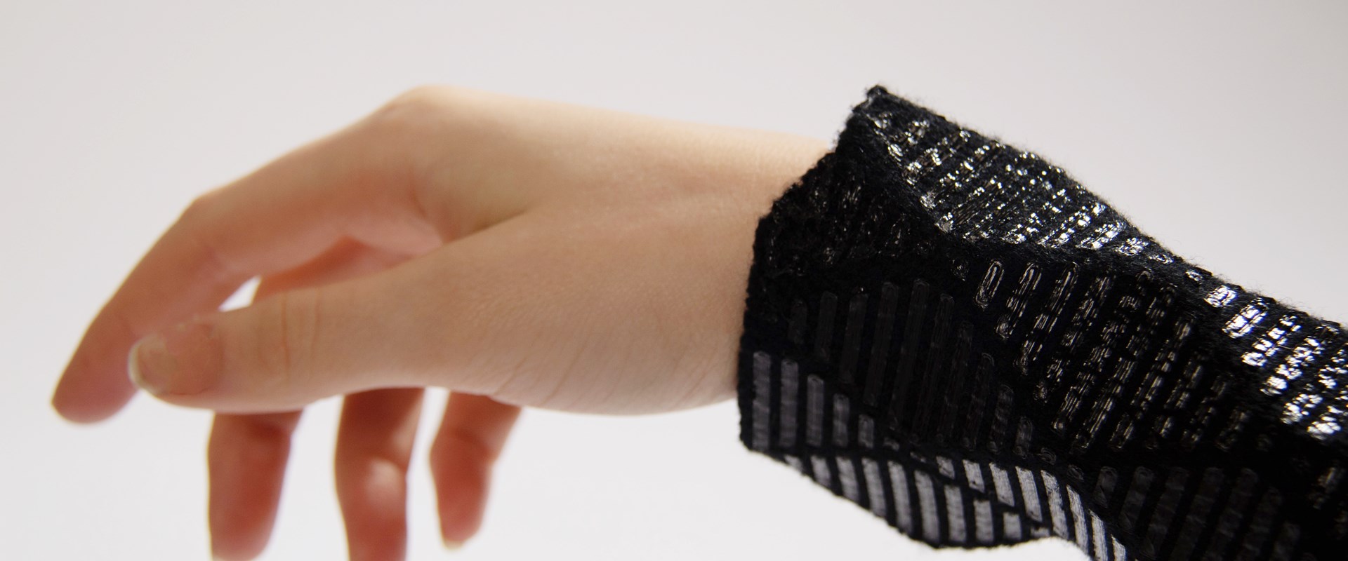 Black textile piece for the wrist.