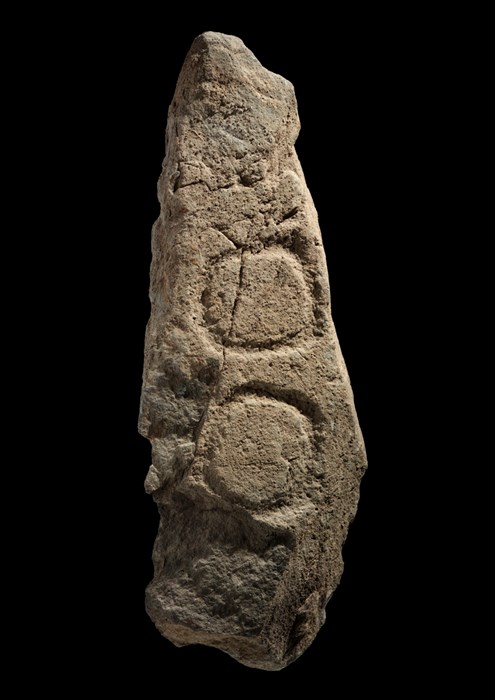 A stone pillar with archaeological carvings