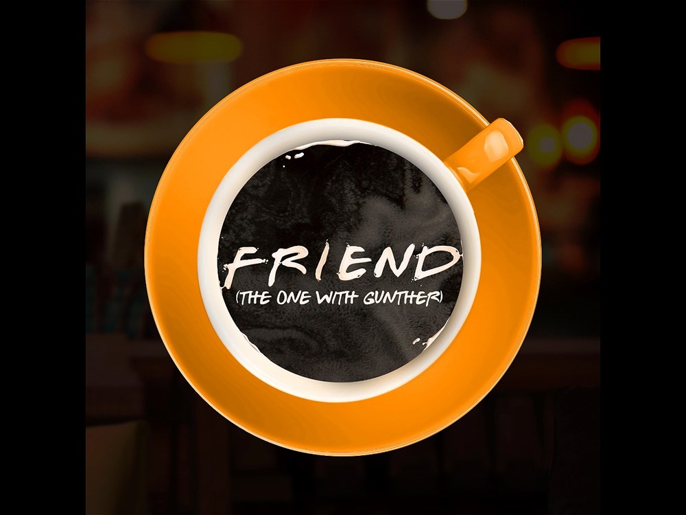 A birdseye view of a coffee cup with 'Friend (the one with Gunther)' written in the coffee