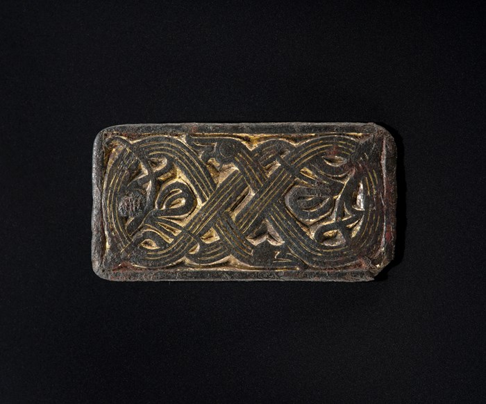 Rectangular Viking-age cast gilded bronze mount with intricate decoration